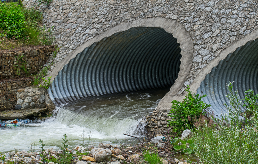 Water running out of storm drain tunnel
