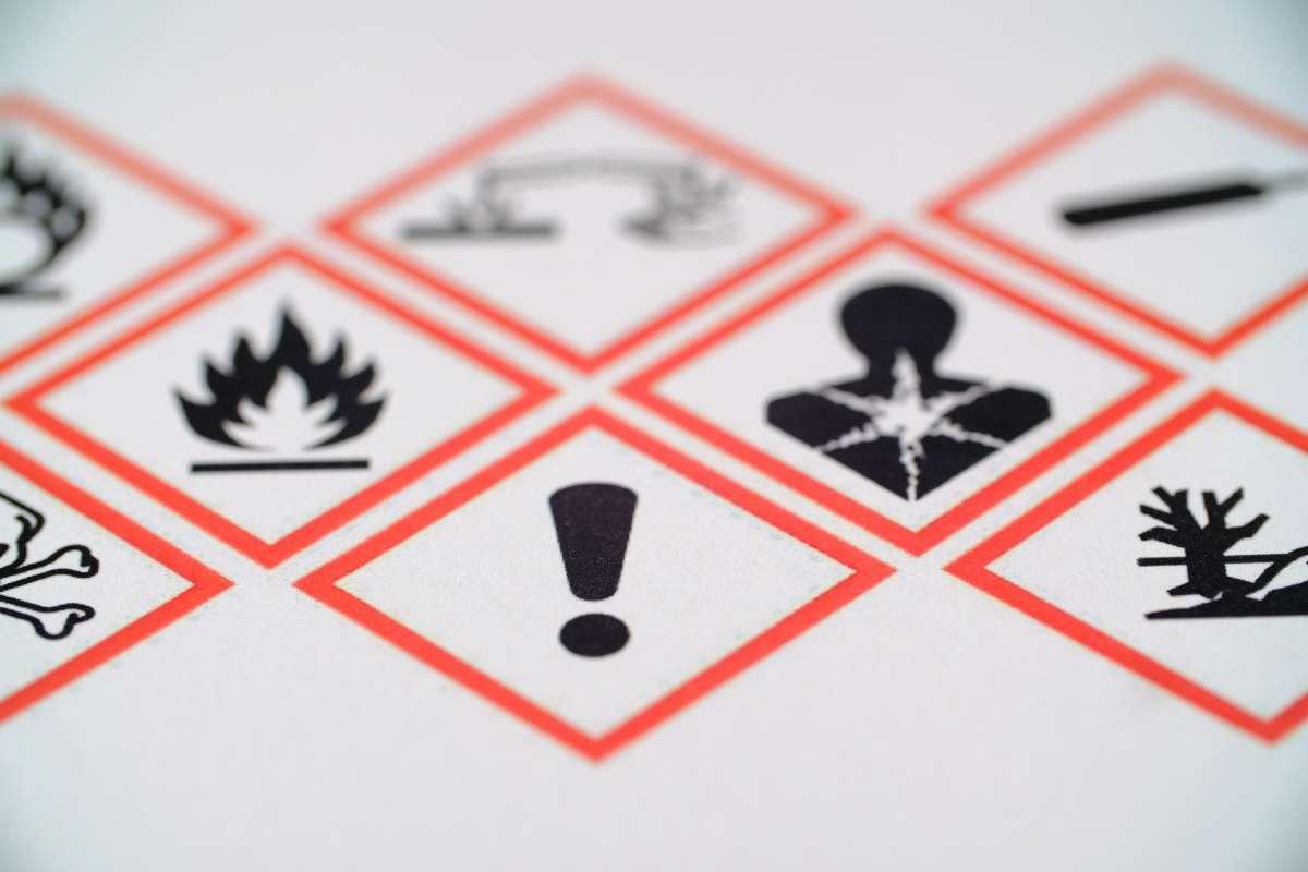 Photo of various hazard communication pictograms printed on a piece of paper