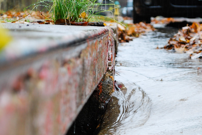 Photo of water running into storm drain