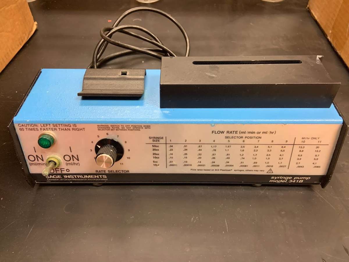 Photo of a syringe pump device in a laboratory in Gilman Hall.