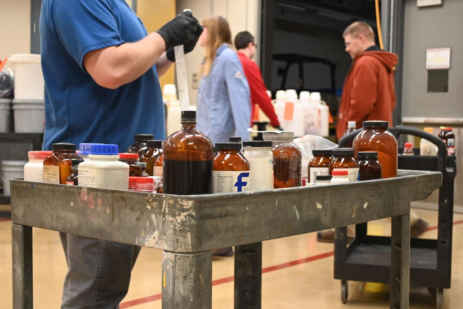 EH&S staff organize waste retrieved from laboratories on campus.